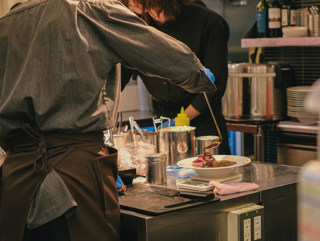 Chefs preparing food in a restaurant kitchen